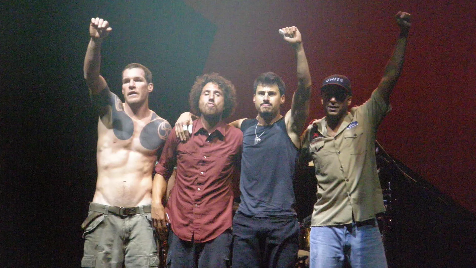 Foto: Penner, CC BY-SA 4.0, <https://commons.wikimedia.org/wiki/File:Rage_Against_The_Machine_(cropped).jpg> via Wikimedia Comms