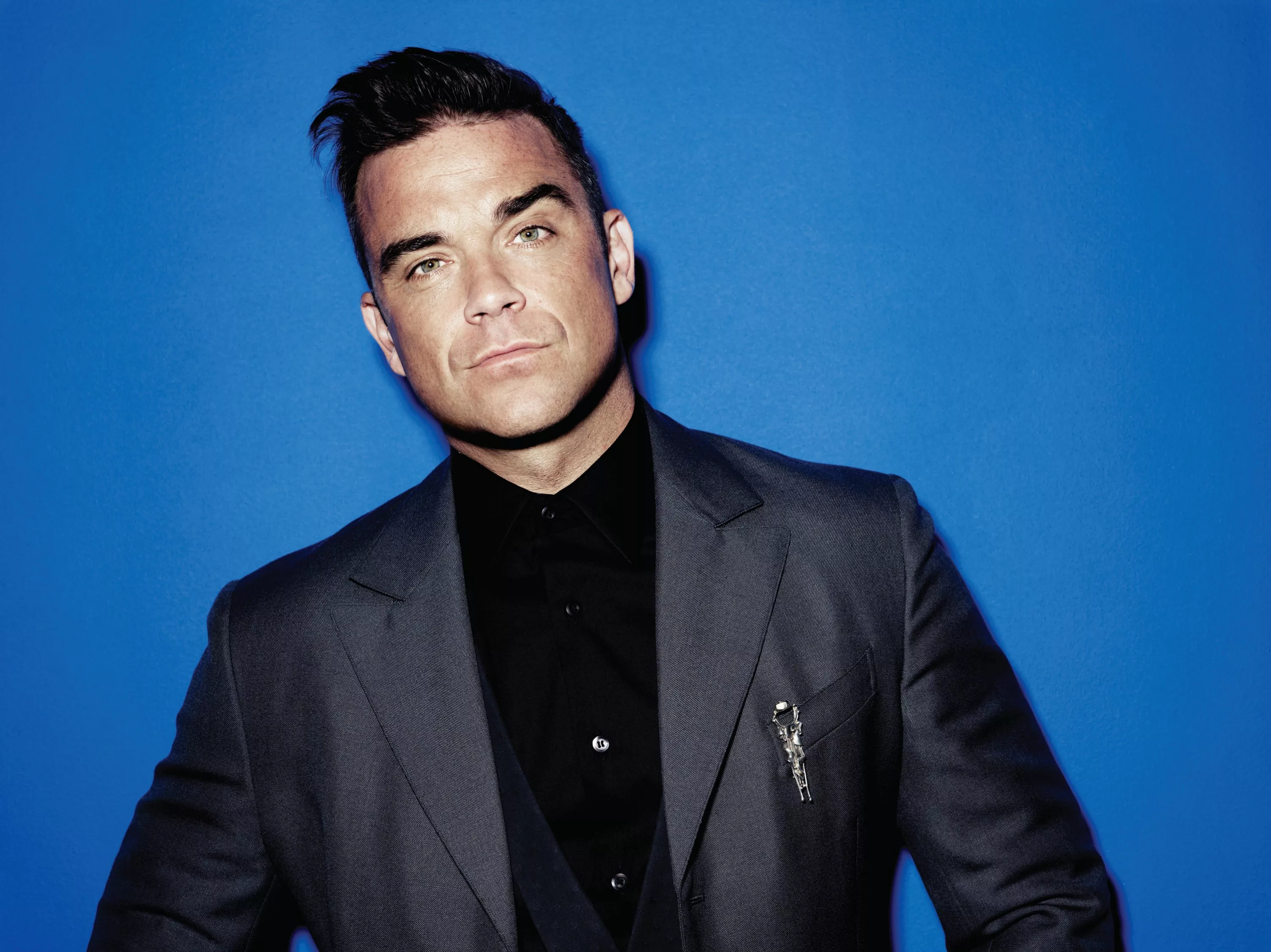 Robbie Williams teaser ny låt skrevet av The Killers